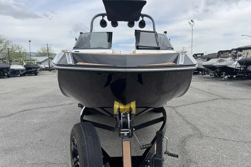 Slide: The Image of 2019 Nautique Super Air Nautique G23 boat on trailer, front view in parking lot. - 11