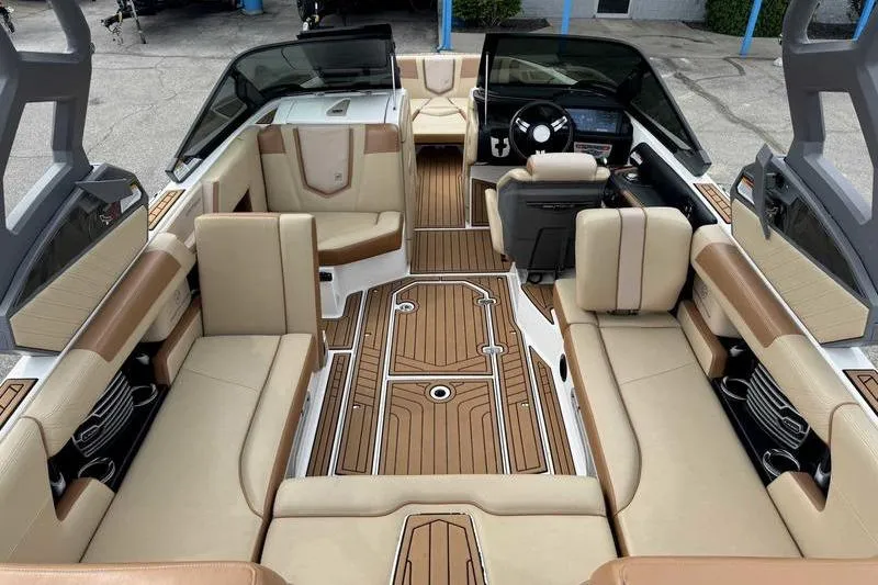 Slide: The Image of 2019 Nautique Super Air Nautique G23 interior with luxurious seating and modern dashboard. - 15