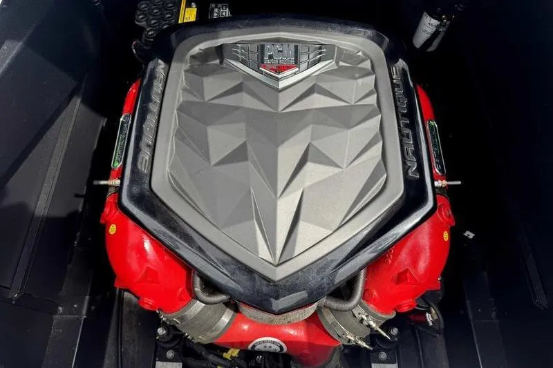 Slide: The Image of 2019 Nautique Super Air Nautique G23 engine with PCM cover, featuring red accents. - 16