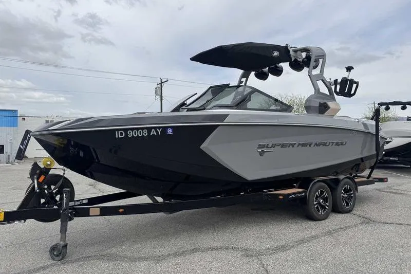Slide: The Image of 2019 Nautique Super Air Nautique G23 boat on trailer in parking lot. - 3