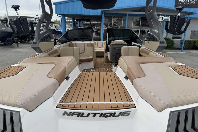Slide: The Image of 2019 Nautique Super Air Nautique G23 boat with luxurious seating and teak flooring. - 4
