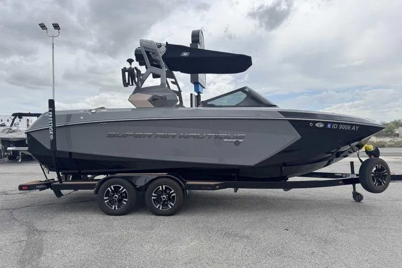 Slide: The Image of 2019 Nautique Super Air Nautique G23 boat on trailer, parked outdoors. - 9
