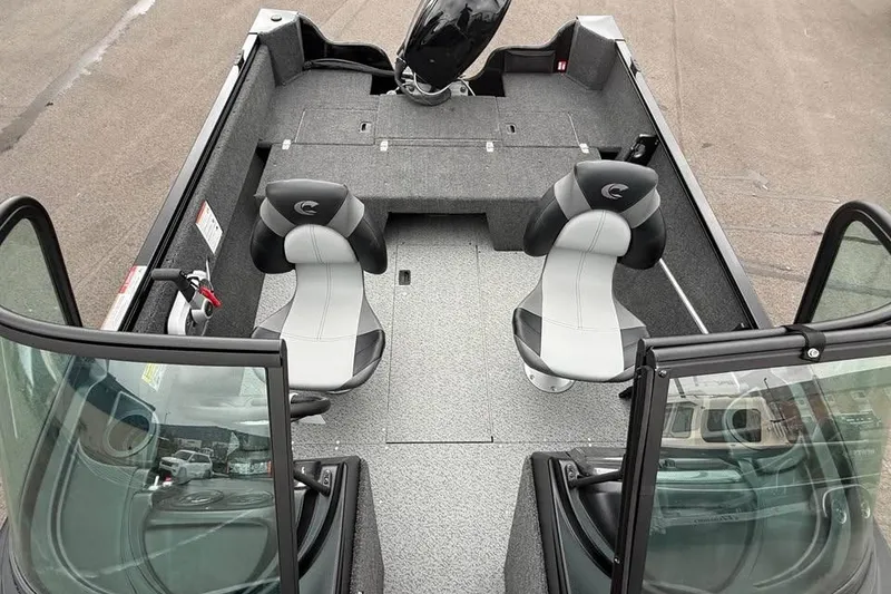 Slide: The Image of 2026 Crestliner 1650 Kodiak boat interior with two seats and windshield. - 10