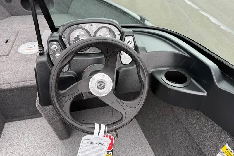 Slide: The Image of Steering console of 2026 Crestliner 1650 Kodiak boat with gauges and cup holder. - 13