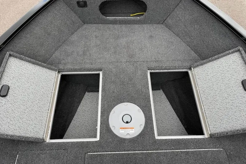 Slide: The Image of 2026 Crestliner 1650 Kodiak boat interior with open storage compartments. - 15