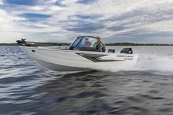Slide: The Image of Manufacturer Provided Image: 2026 Crestliner 1650 Kodiak boat cruising on a lake under a partly cloudy sky. - 19