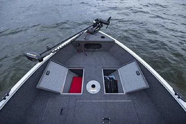 Slide: The Image of Manufacturer Provided Image: 2026 Crestliner 1650 Kodiak boat with open storage compartments on a lake. - 25