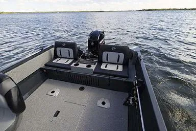 Slide: The Image of Manufacturer Provided Image: 2026 Crestliner 1650 Kodiak boat interior with seating, on a calm lake. - 28