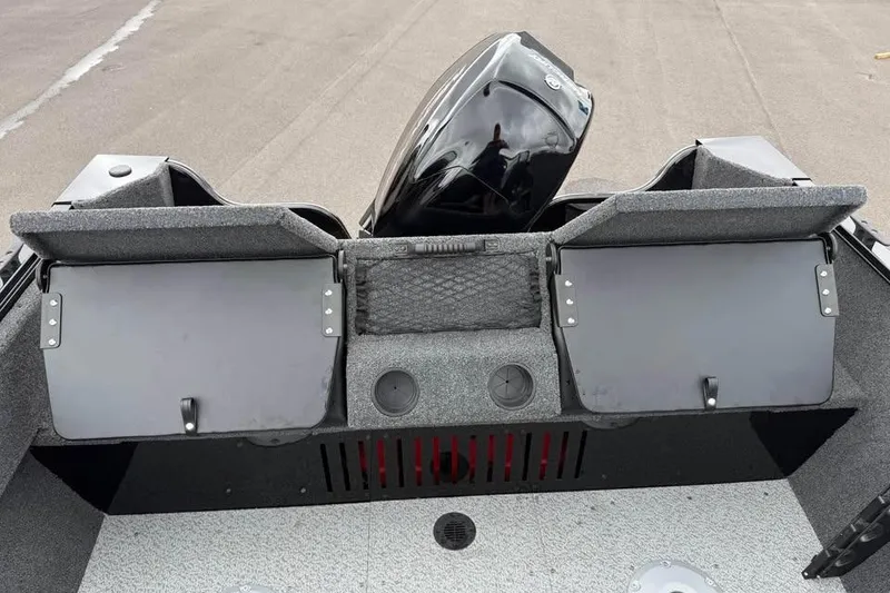 Slide: The Image of 2026 Crestliner 1650 Kodiak boat interior with storage compartments and motor. - 8