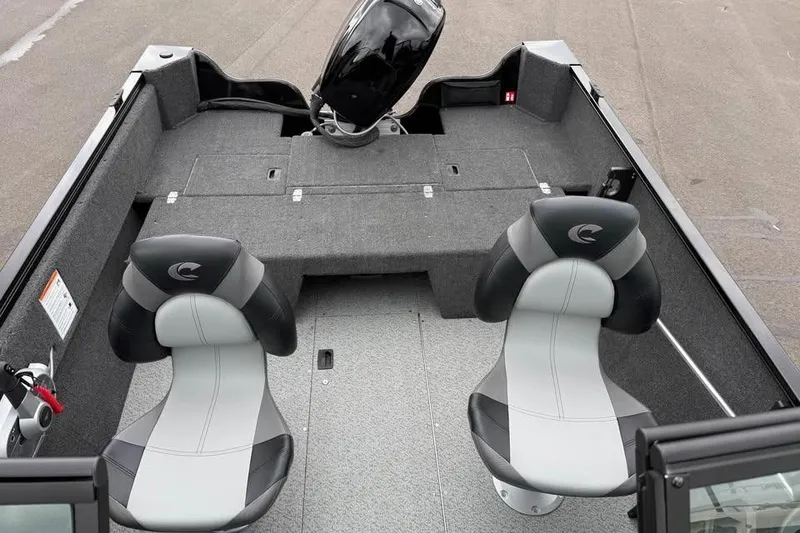 Slide: The Image of 2026 Crestliner 1650 Kodiak boat interior with two seats and motor. - 9
