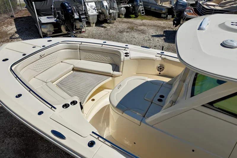 Slide: The Image of 2026 Scout 330 LXF boat interior with luxurious seating and modern design. - 17