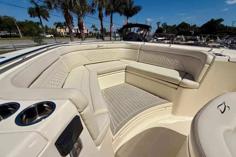 Slide: The Image of Luxurious seating area on 2026 Scout 330 LXF boat with elegant upholstery and cup holders. - 21