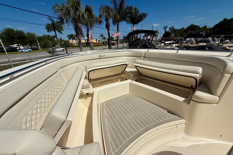 Slide: The Image of Luxurious interior of 2026 Scout 330 LXF boat with plush seating and storage. - 27