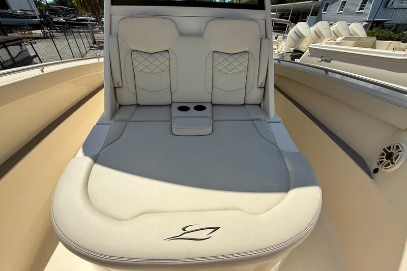 Slide: The Image of Luxurious seating on 2026 Scout 330 LXF boat, featuring elegant design and cup holders. - 29