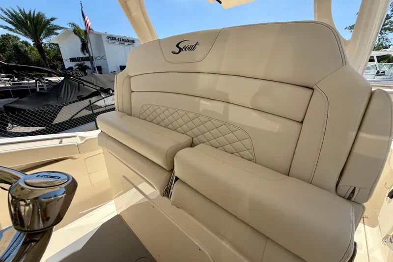 Slide: The Image of Luxurious seating on 2026 Scout 330 LXF boat, featuring elegant beige upholstery and diamond stitching. - 33