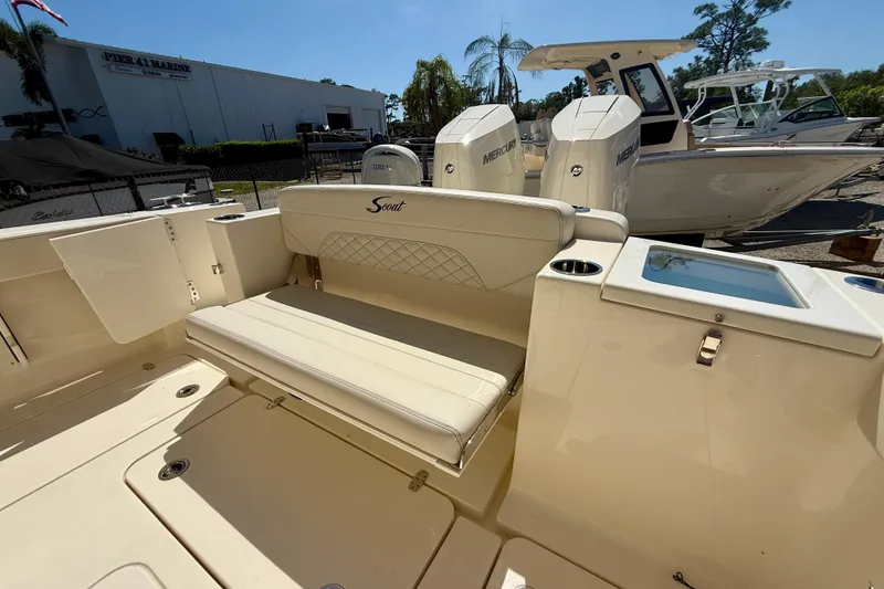 Slide: The Image of 2026 Scout 330 LXF boat interior with seating and dual Mercury engines. - 40