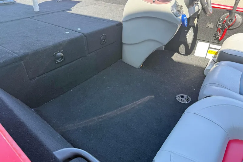 Slide: The Image of Interior of a 2007 Tracker Pro Team 175 TXW boat, featuring seating and storage. - 10