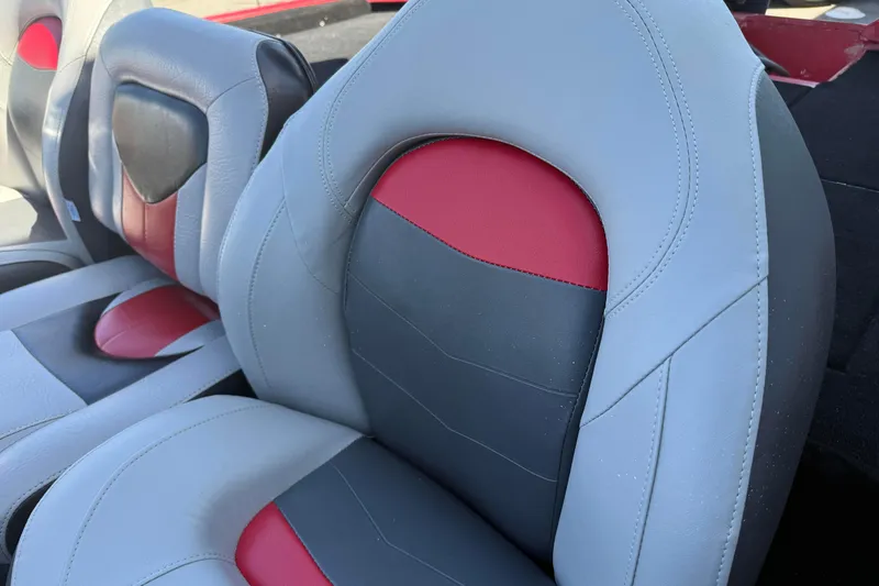 Slide: The Image of 2007 Tracker Pro Team 175 TXW boat seats, featuring gray and red upholstery. - 12
