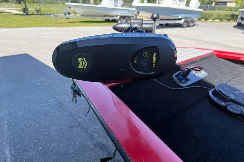 Slide: The Image of Minn Kota Terrova motor on 2007 Tracker Pro Team 175 TXW boat, parked outdoors. - 14