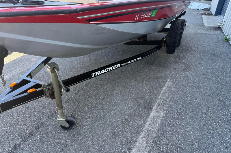 Slide: The Image of 2007 Tracker Pro Team 175 TXW boat on a Trailstar trailer, parked on asphalt. - 16