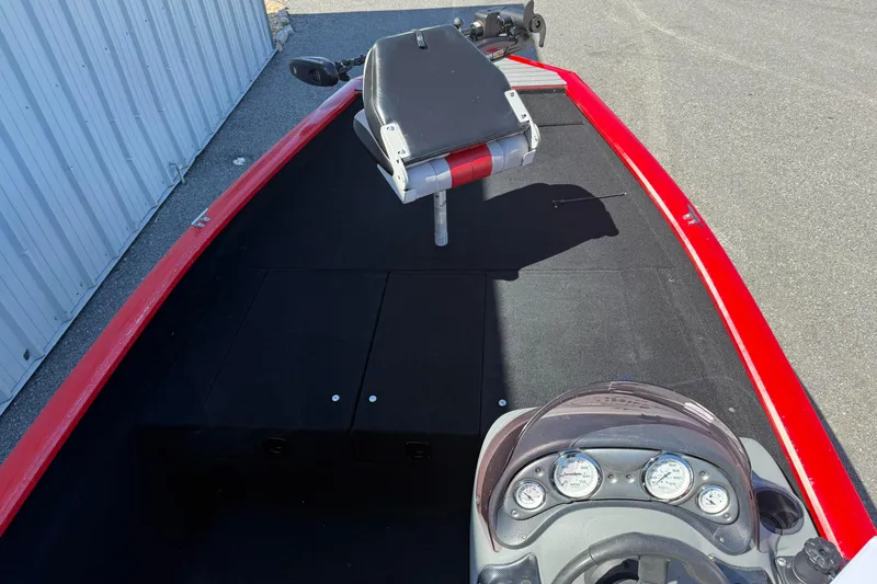 Slide: The Image of 2007 Tracker Pro Team 175 TXW boat interior with red trim and steering console. - 19