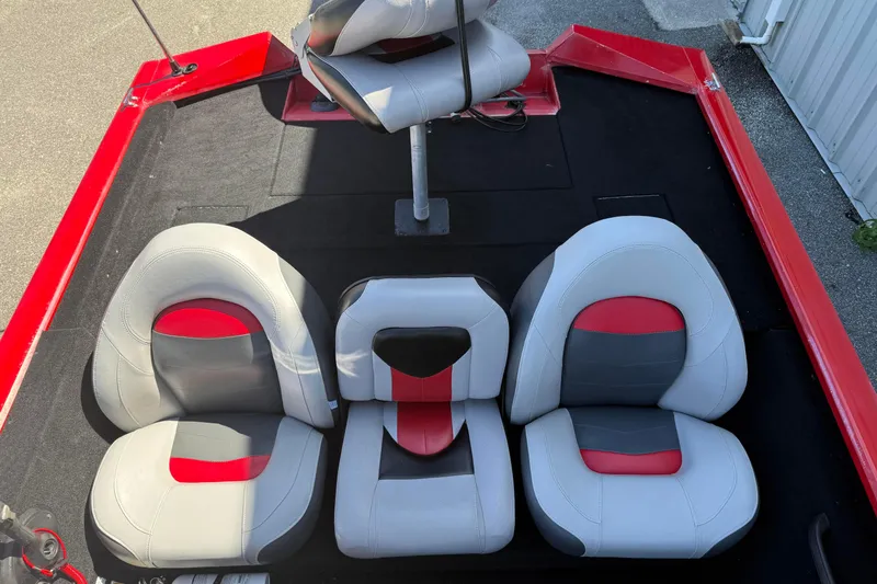 Slide: The Image of 2007 Tracker Pro Team 175 TXW boat interior with red and gray seating arrangement. - 20