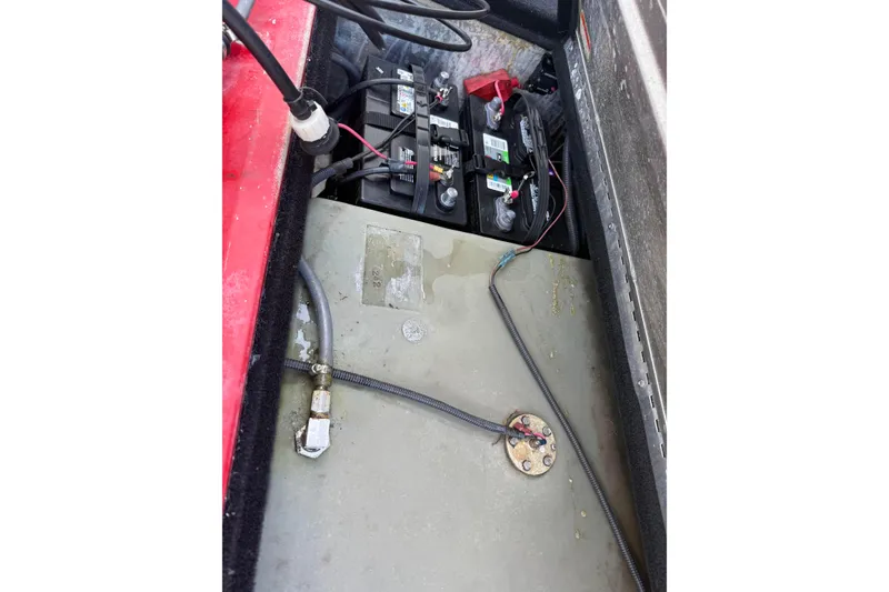 Slide: The Image of Battery compartment of a 2007 Tracker Pro Team 175 TXW boat, showing wiring and connections. - 21