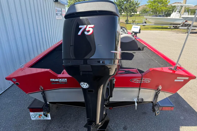 Slide: The Image of 2007 Tracker Pro Team 175 TXW boat with 75 HP motor, parked outdoors. - 4