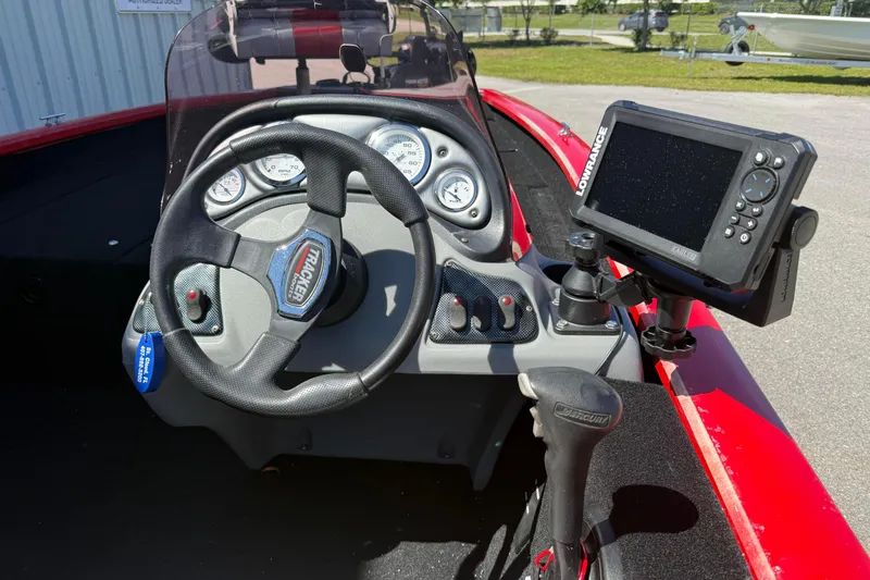 Slide: The Image of 2007 Tracker Pro Team 175 TXW boat dashboard with steering wheel and Lowrance fish finder. - 6