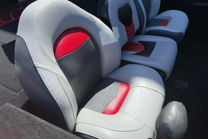 Slide: The Image of 2007 Tracker Pro Team 175 TXW boat seats with red, gray, and black upholstery. - 8