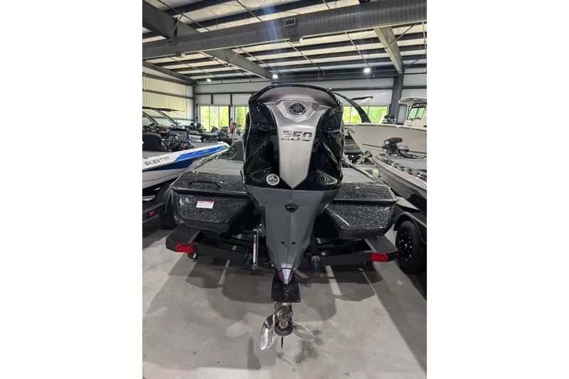 Slide: The Image of 2026 Skeeter ZXR21 SE boat in showroom, featuring powerful 350 engine. - 10