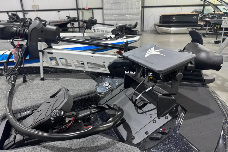 Slide: The Image of 2026 Skeeter ZXR21 SE boat with advanced navigation and control systems in a showroom. - 3