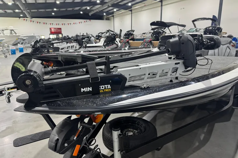Slide: The Image of 2026 Skeeter ZXR21 SE boat with Minn Kota Ultrex motor in showroom. - 5