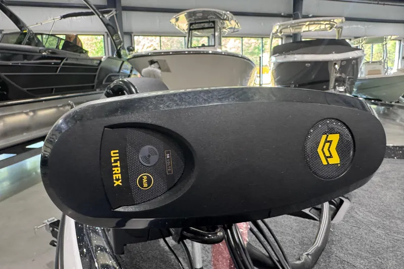 Slide: The Image of Trolling motor on 2026 Skeeter ZXR21 SE boat in showroom setting. - 6