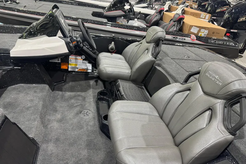 Slide: The Image of 2026 Skeeter ZXR21 SE boat interior with sleek gray seats and modern dashboard. - 8