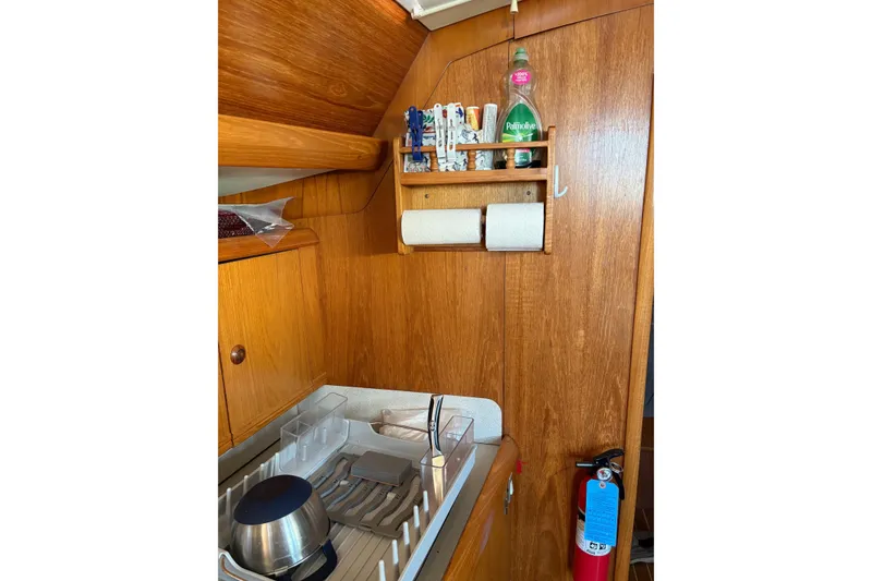 Slide: The Image of Wooden interior of 2001 Jeanneau Sun Odyssey 45.2 yacht kitchen area. - 13