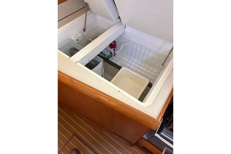 Slide: The Image of Interior view of Jeanneau Sun Odyssey 45.2 yacht's kitchen storage, 2001 model. - 14