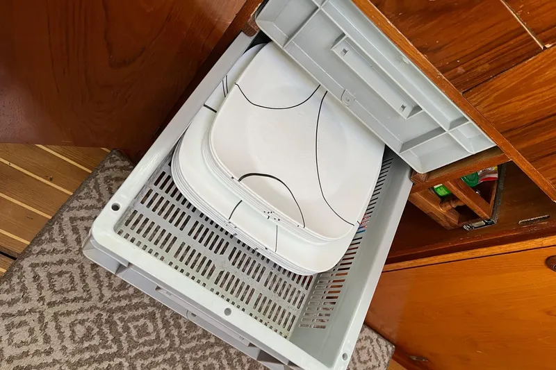 Slide: The Image of Storage drawer with plates on Jeanneau Sun Odyssey 45.2 yacht, 2001 model. - 16