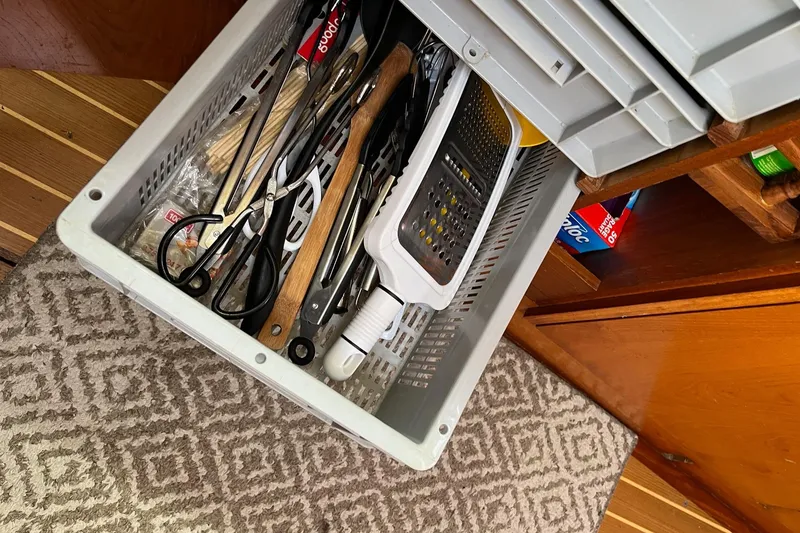 Slide: The Image of Kitchen drawer with utensils on Jeanneau Sun Odyssey 45.2 yacht, 2001 model. - 17