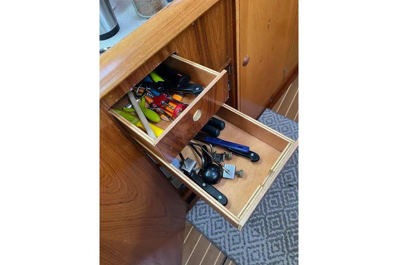 Slide: The Image of Open drawer with tools on Jeanneau Sun Odyssey 45.2 yacht, 2001 model. - 19