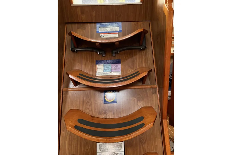 Slide: The Image of Wooden steps inside a 2001 Jeanneau Sun Odyssey 45.2 yacht, featuring safety grip strips. - 25
