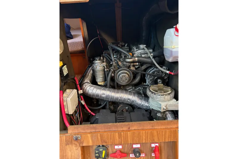 Slide: The Image of Engine compartment of a 2001 Jeanneau Sun Odyssey 45.2 sailboat, showcasing mechanical components. - 26