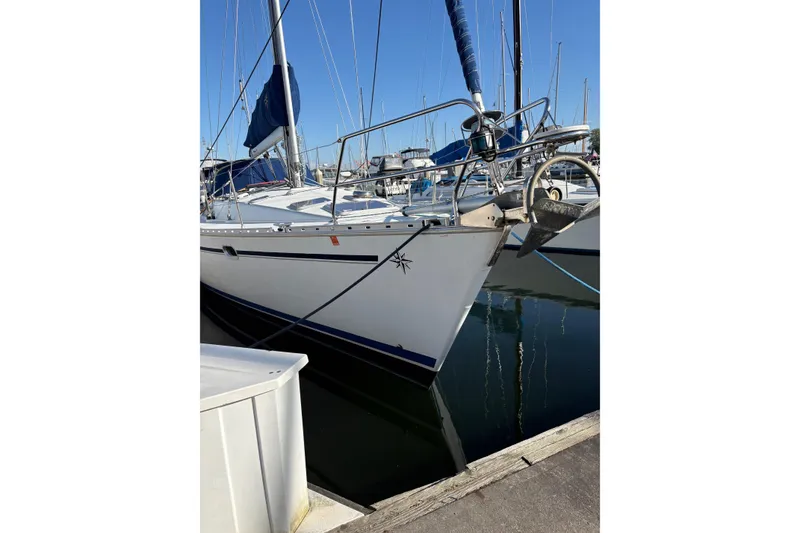 Slide: The Image of 2001 Jeanneau Sun Odyssey 45.2 sailboat docked in marina, clear blue sky. - 28