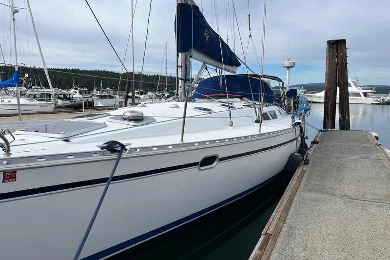Slide: The Image of 2001 Jeanneau Sun Odyssey 45.2 sailboat docked at marina, overcast sky. - 29