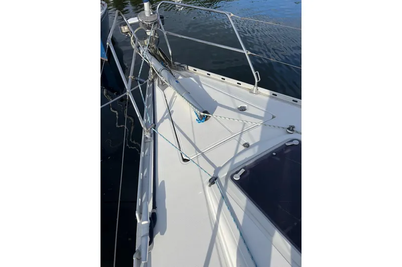 Slide: The Image of Deck view of 2001 Jeanneau Sun Odyssey 45.2 sailboat, featuring rigging and railing. - 30