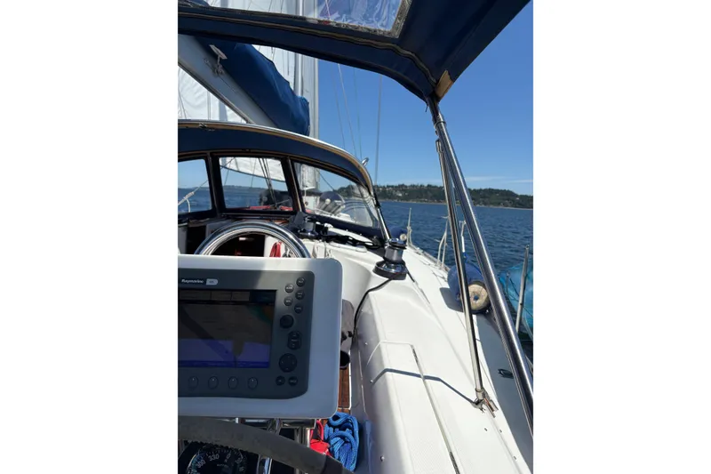 Slide: The Image of Cockpit view of 2001 Jeanneau Sun Odyssey 45.2 sailing on open water. - 37