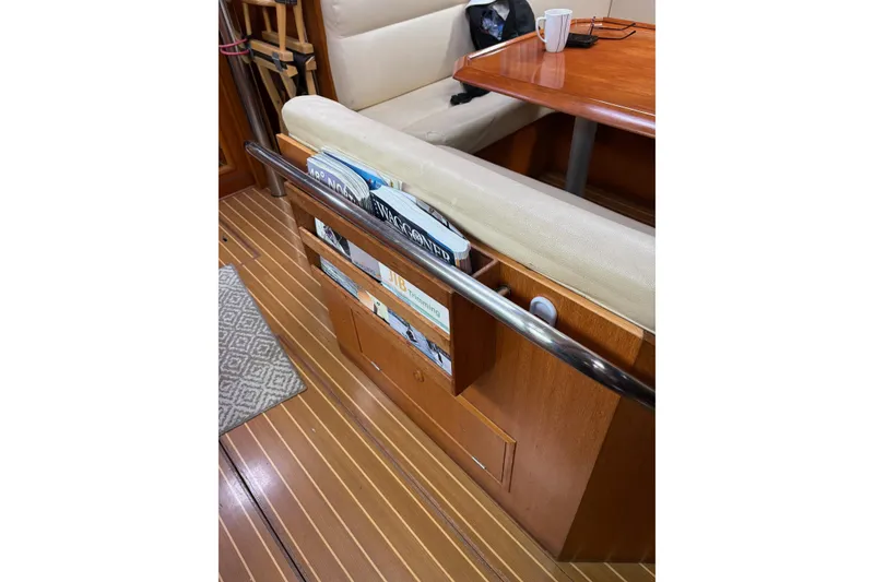 Slide: The Image of Interior of 2001 Jeanneau Sun Odyssey 45.2 yacht with wooden flooring and seating area. - 4