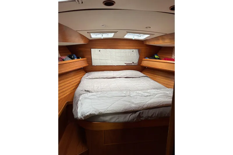 Slide: The Image of Cozy cabin interior of 2001 Jeanneau Sun Odyssey 45.2 sailboat with wooden finish. - 5