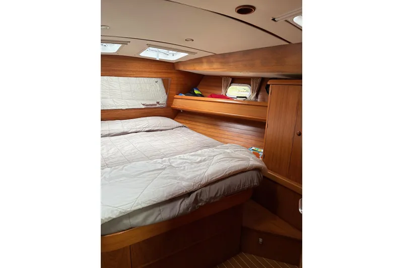 Slide: The Image of Cozy cabin interior of 2001 Jeanneau Sun Odyssey 45.2 sailboat with wooden finish. - 7