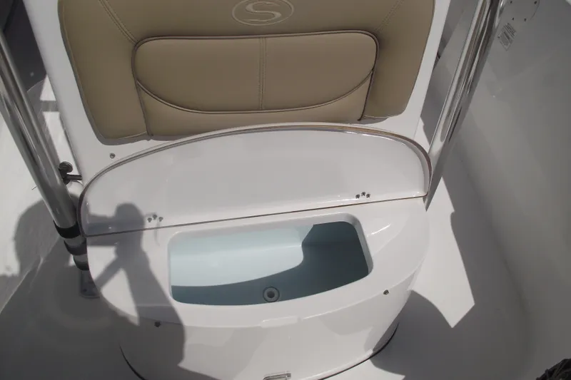 Slide: The Image of 2016 Sportsman Open 212 Center Console seat with storage compartment open. - 16